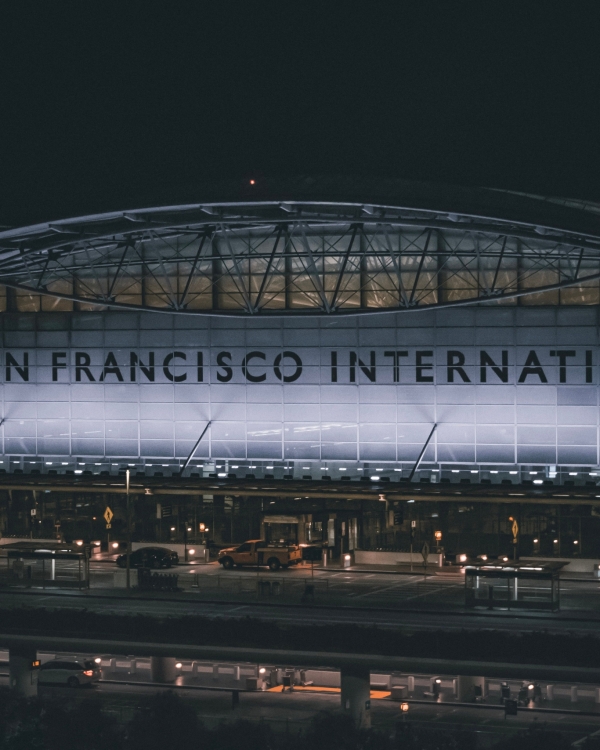 Dramatic nighttime view of the illuminated facade at San Francisco International Airport.