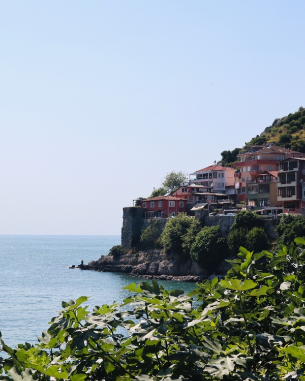 Beautiful view of Amasra's coastal homes perched on cliffs overlooking the sea.